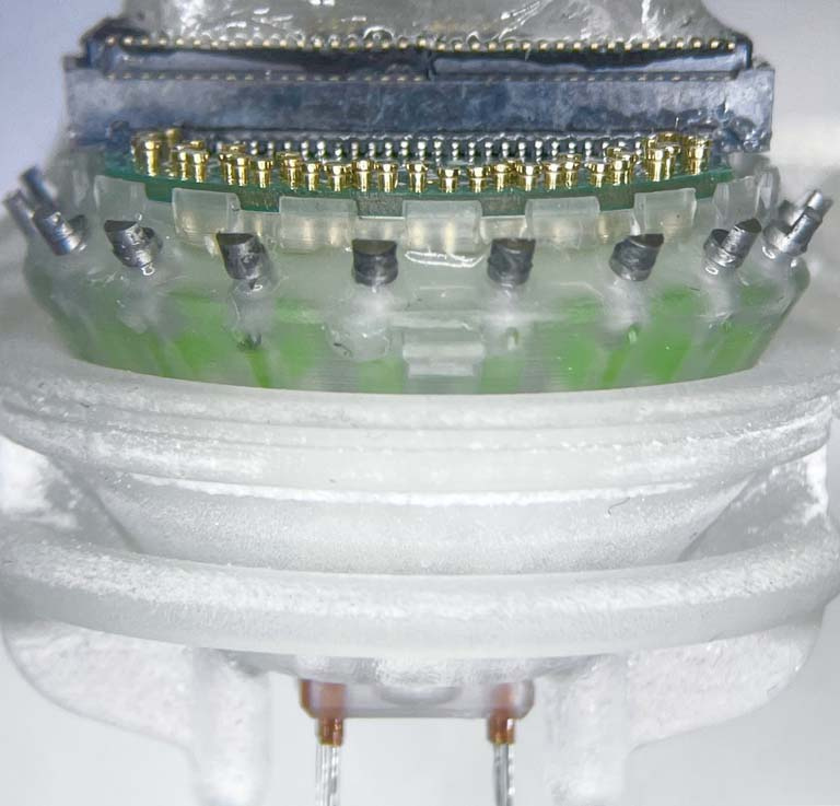 circular layers of electrodes, plastic, metal, and wires